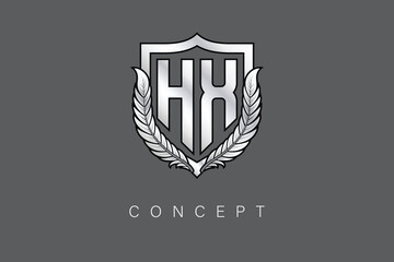 HX Creative Initial Letter Logo with Shield and Laurel Wreath Silver Metallic Branding Emblem on Gray Background.
