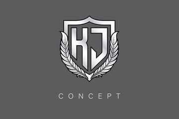 Obraz premium KJ Creative Initial Letter Logo with Shield and Laurel Wreath Silver Metallic Branding Emblem on Gray Background.