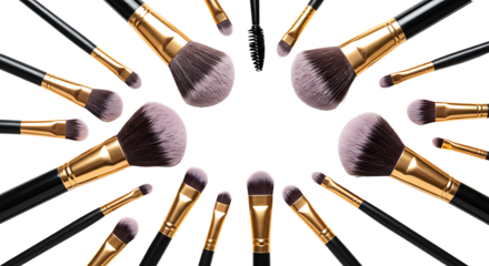 Various professional cosmetic makeup brushes arranged in a circular frame on a clean white isolated background with copy space
