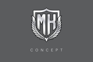 MK Creative Initial Letter Logo with Shield and Laurel Wreath Silver Metallic Branding Emblem on Gray Background.