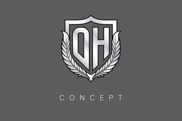 O Creative Initial Letter Logo with Shield and Laurel Wreath Silver Metallic Branding Emblem on Gray Background.