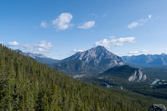 Majestic mountain range displays stunning wilderness in a clear blue sky setting - Powered by Adobe