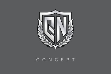 QN Creative Initial Letter Logo with Shield and Laurel Wreath Silver Metallic Branding Emblem on Gray Background.