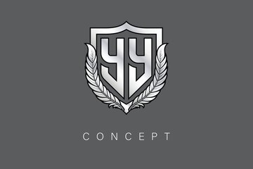 YY Creative Initial Letter Logo with Shield and Laurel Wreath Silver Metallic Branding Emblem on Gray Background.
