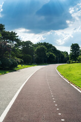 New pathway and beautiful trees track for running or walking and cycling relax in the park