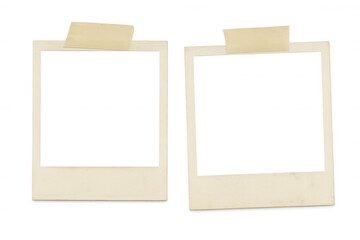 Vintage photo frames, blank and taped together, waiting on transparent surface for personalized memories