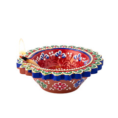 Beautifully ornate diya lamp glows warm light, symbolizing hope and tradition