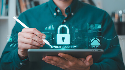Cybersecurity professional using tablet with padlock icon for data protection