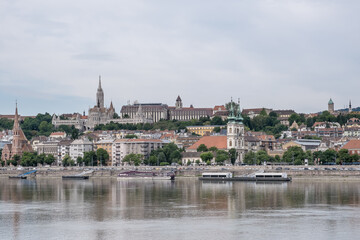 Budapest, Hungary – View of the Danube River with the Buda side in the background. Far in the distance, Fisherman’s Bastion crowns Castle Hill with its fairytale-like silhouette.