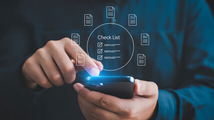 Person using phone to complete checklist, modern technology concept
