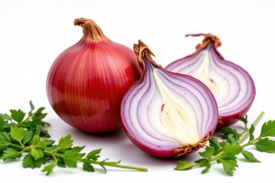 Fresh red onions with white and purple interior halves and green herbs on a clean white background for healthy cooking fresh vegetable ingredients