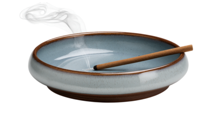 Incense Stick Burning in Blue Ceramic Bowl with Smoke isolated on a transparent background