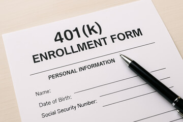 Fototapeta premium 401k plan enrollment form with pen on desk showing personal information section for retirement savings