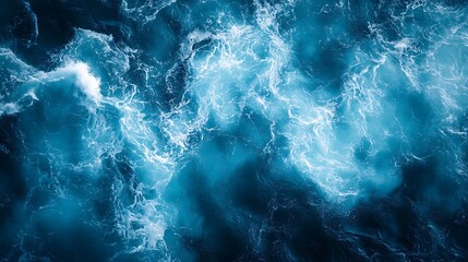 Obraz premium Aerial view of ocean foam patterns on deep blue water with organic texture, calm atmosphere and wide left copy space, minimal serene concept for nature, marine, sea and coastal design themes