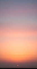 Fototapeta premium Peaceful sunset hues blending over a serene landscape scenery