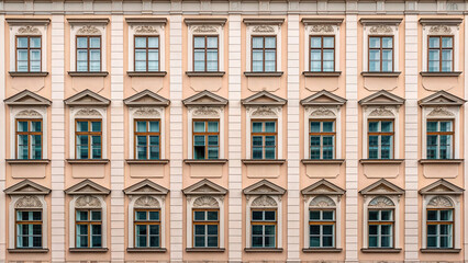 Fototapeta premium Ornate Facade with Multiple Rows of Classical Windows and Decorative Elements architecture
