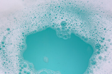 Foamy blue water surface with bubbles.