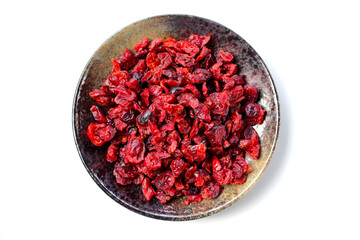 Dried cranberries piled on a white background