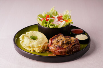 Bacon-Wrapped Pork Fillet with Mashed Potatoes and Salad
