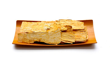 Dried Astragalus root slices used in traditional Chinese medicine.