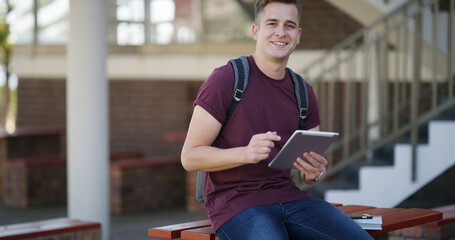 Smile, tablet and portrait of student in college for education, research thesis and scholarship application. Dissertation grant, university and learning with man outdoor for online project