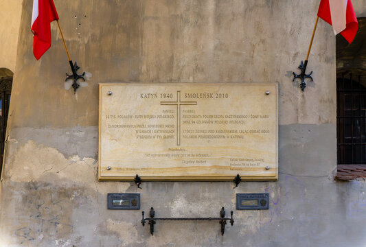 Memorial plaque on a wall in Kalisz dedicated to victims of Katyn 1940 and Smolensk 2010 tragedy, with Polish flags