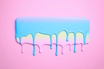 Pastel paint drips on pink background