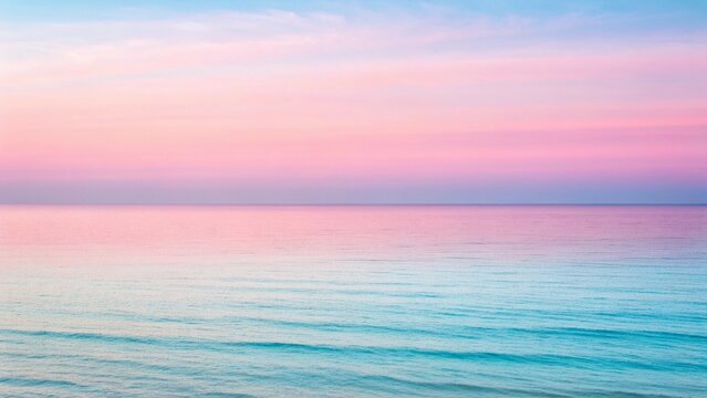 Serene ocean horizon with pastel pink and blue sky at sunrise or sunset water