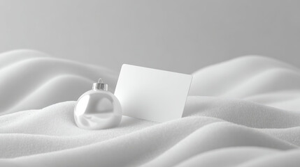 Elegant silver ornament and blank card on soft white snow beautiful sustainable christmas concept. Minimalist holiday background with copy space for festive message