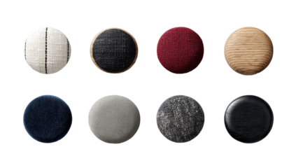 Nine round decorative objects, various colors and materials, viewed from above. 