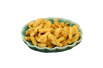 Isolated bowl of deep fried crispy pork skin