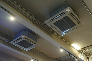 Obraz premium Interior design and decoration of industrial loft building decorated with cement concrete pillar and high performance air conditioning machine