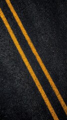 Yellow road line marking on asphalt texture background, double stripes, urban transportation, traffic system and roadway infrastructure closeup.