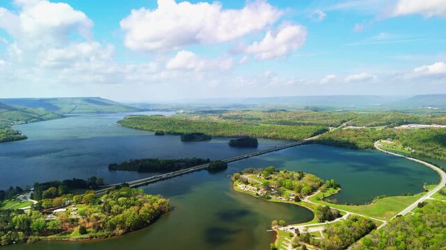 An aerial view of highway bridges crossing the Tennessee River with island on Marion County Park near Chattanooga on a sunny day in Tennessee, USA
