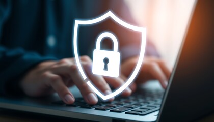 Person typing on laptop keyboard with glowing shield and padlock icon computer technology