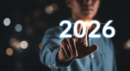 Person points to glowing 2026 as future unfolds digital technology
