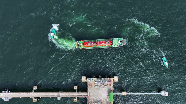 Aerial view LPG tanker ship at sea, Red LPG tanker ship top view, Logistic and maritime transportation of petroleum, Modern offshore terminal  loading tanker ship.