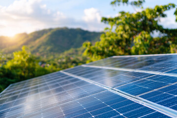 A solar panel is on a roof with a view of the mountains