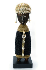 Balinese decorative wooden figurine with seashells on white background