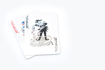 Two joker playing cards on white background