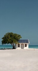 Obraz premium Minimalist white beach house with single tree on pristine sandy shore against clear blue sky in tropical paradise setting