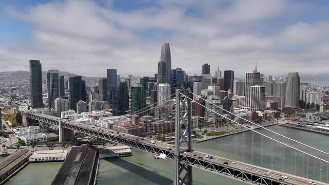 An aerial view of San Francisco reveals a vibrant cityscape of rolling hills, diverse architecture, and iconic landmarks nestled along the edge of the Pacific coast.