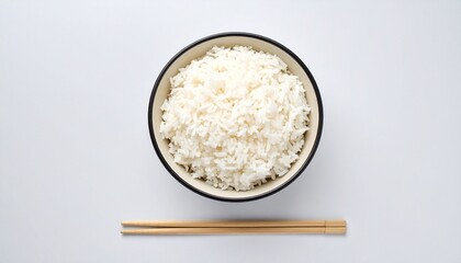 A bowl of cooked white rice, ready to eat, with chopsticks beside it on a plain white background.