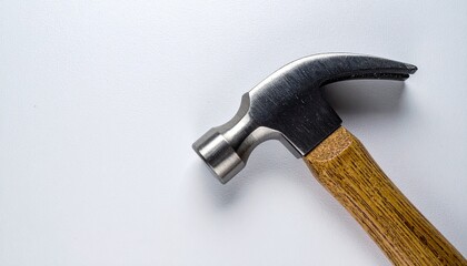 A close-up studio shot of a claw hammer with a wooden handle isolated on a clean white background.