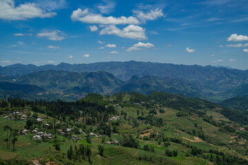 Fototapeta premium The road winds through the mountain, revealing a scenic landscape where nature meets the sky, turning every mile of the journey into a breathtaking experience.