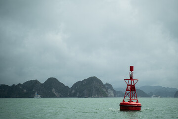 A buoy floats on the ocean, sending a maritime warning to ensure safety at sea, guiding navigation...