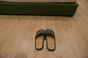 hotel slippers, woven shoes was removed on the cozy floor.