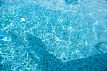 Swimming pool surface, waves in outdoor swimming pools