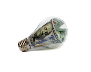 Green energy light bulb isolated on white background. Selective focus.