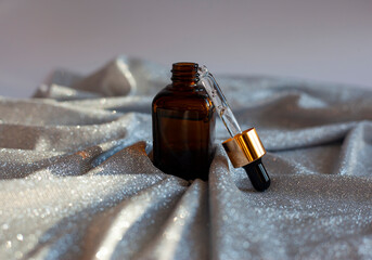 beautiful flat lay skin care pink serum liquid dropper minimal background.